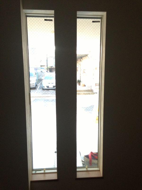 Entrance. Stylish elongated window in the front door next to