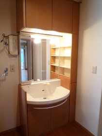 Washroom. Big is the washstand of the mirror.