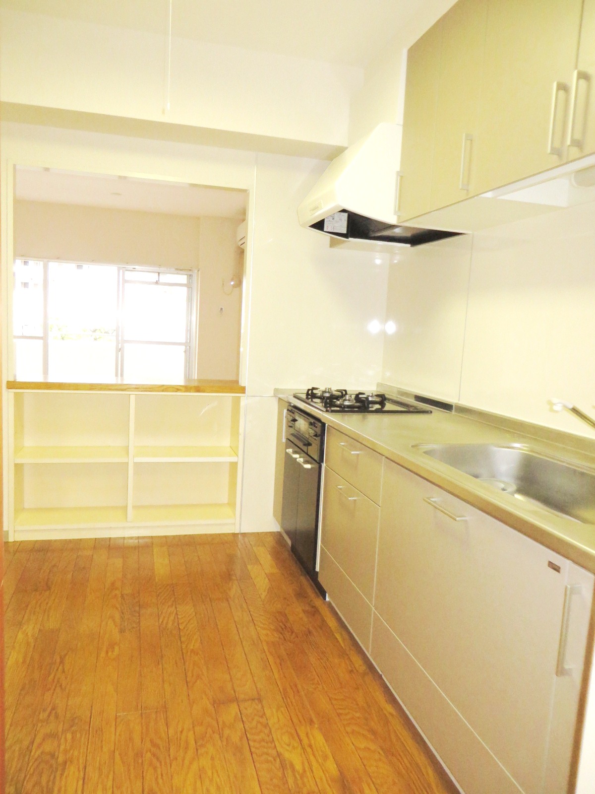 Kitchen. Living and has partition at the counter.