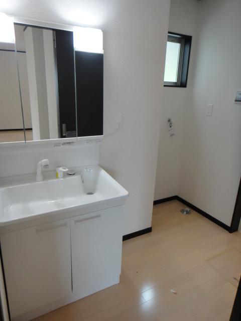 Bathroom. Wide wash basin. Washing device Storage.