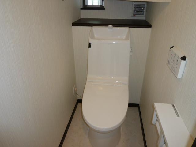 Toilet. Tank-integrated toilet Building A