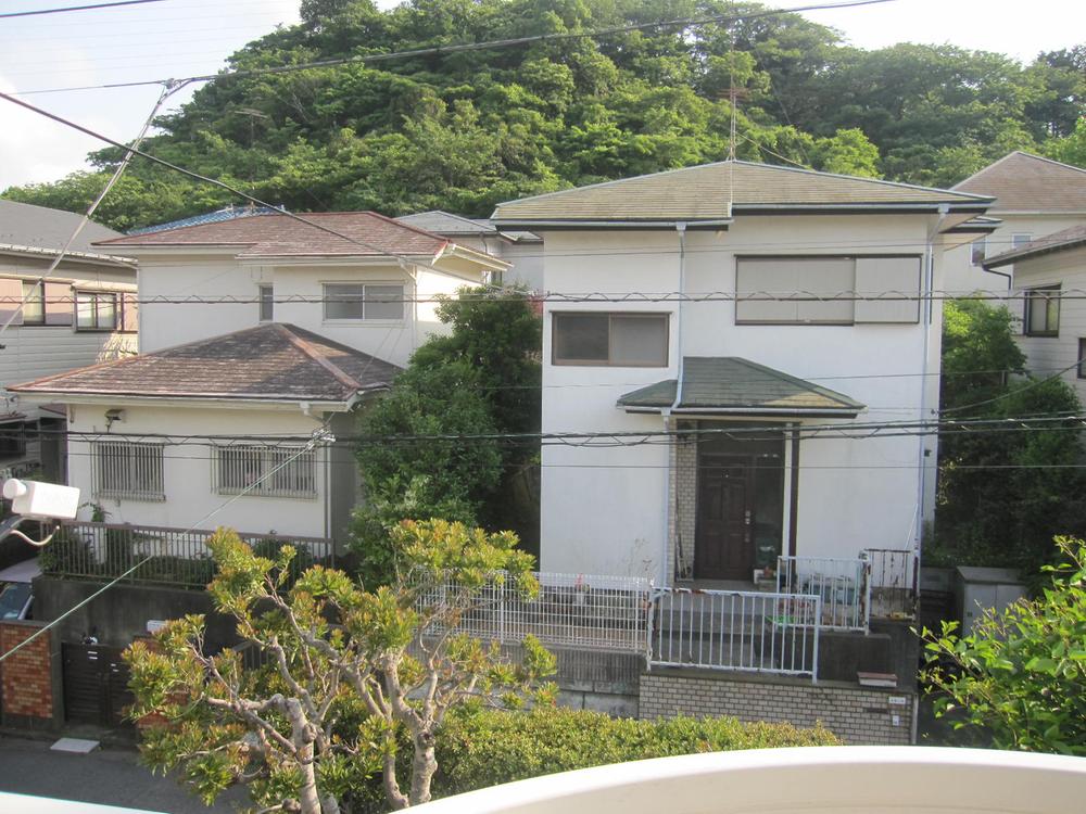 View photos from the local. Second floor view of the current state building. The surroundings are lush green residential area.