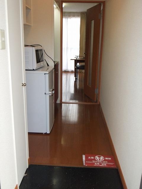 Living and room. It is a photograph that was taken the room from the front door.