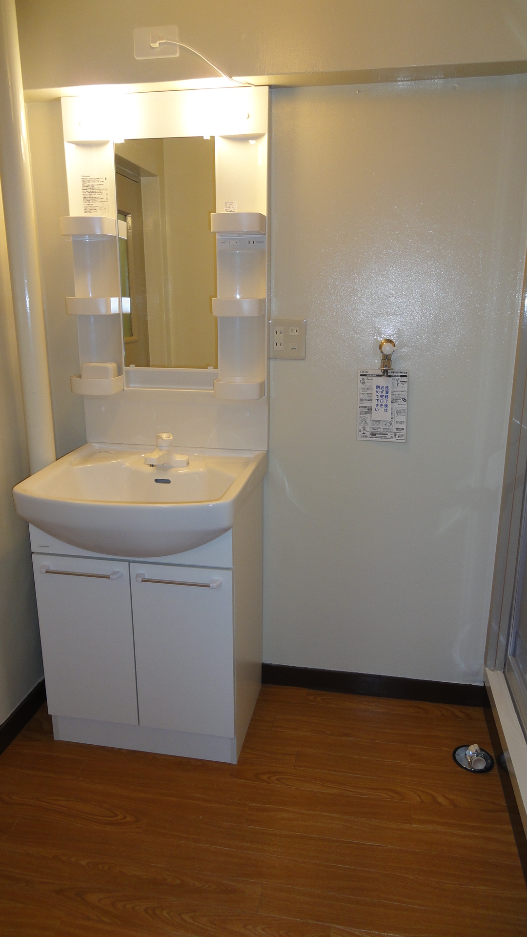 Washroom. It marked with a mirror cabinet wash basin of new.