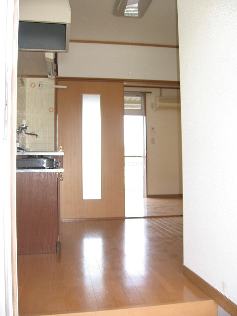 Living and room. Overlooking the room from the front door, Floor is bright and clean feeling!