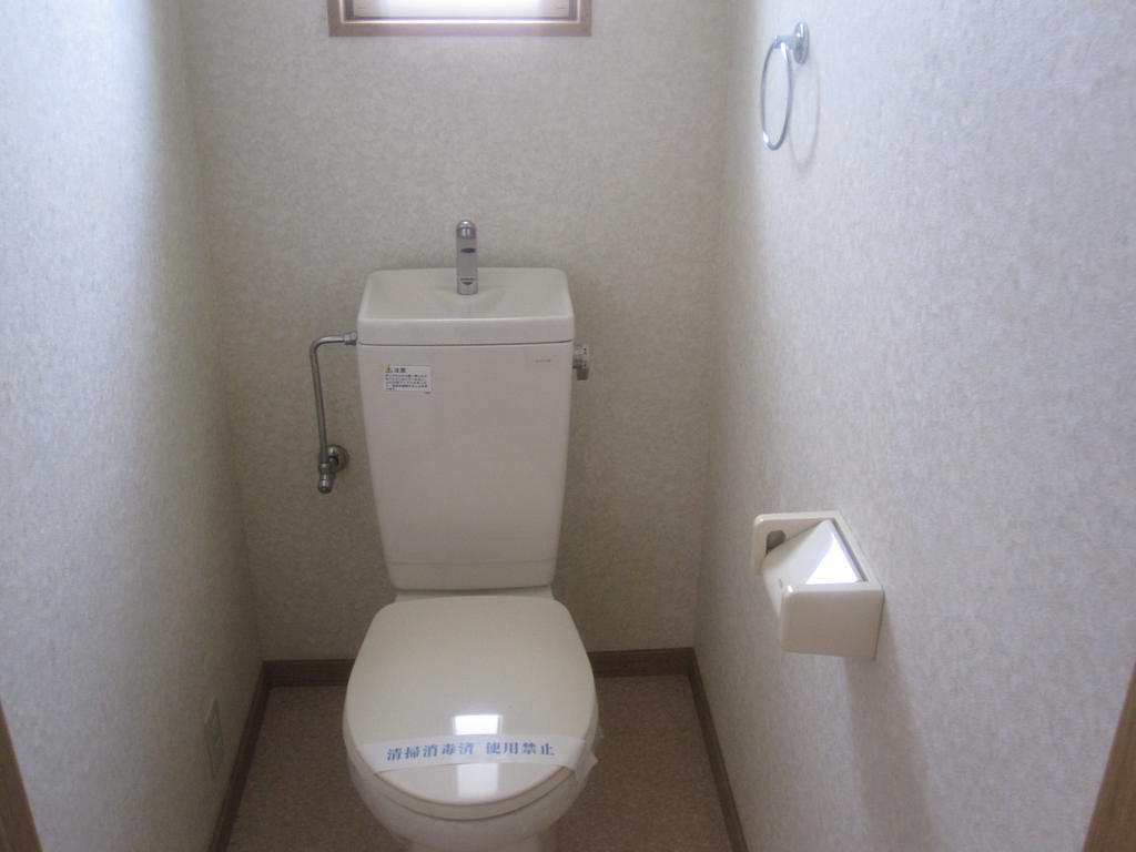 Toilet. There is a small window