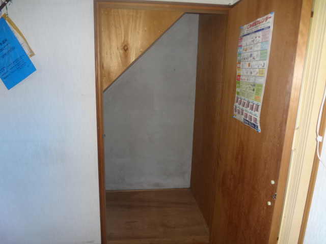 Receipt. Staircase under storage.