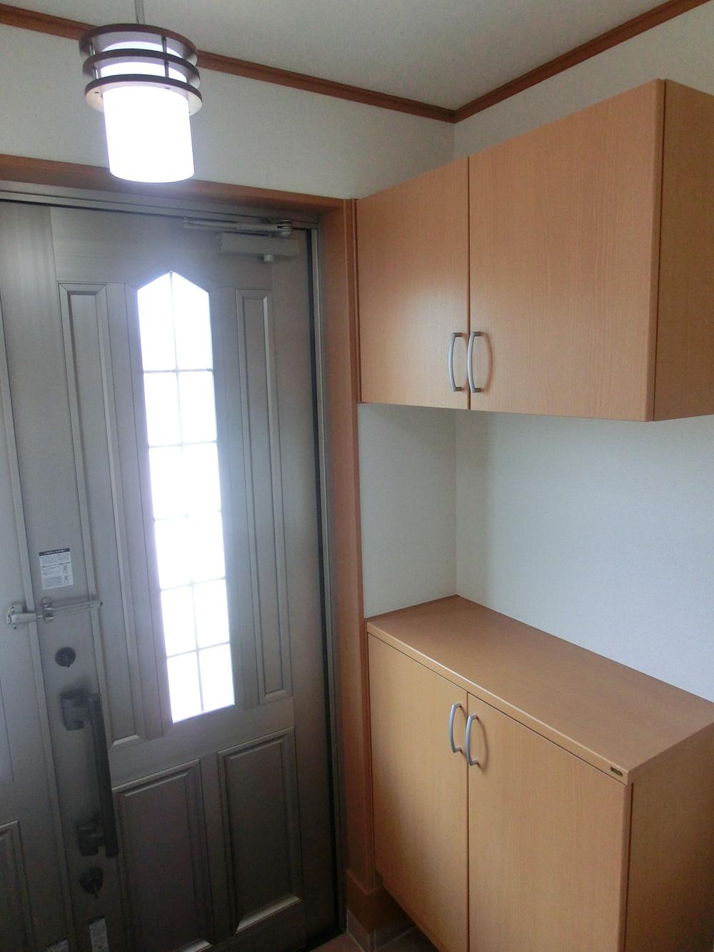 Entrance. Cupboard, Entrance door.