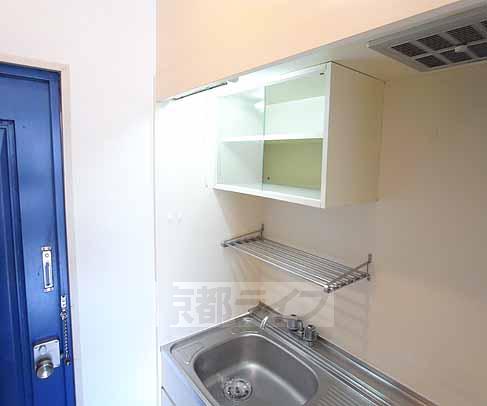 Entrance. This kitchen storage.