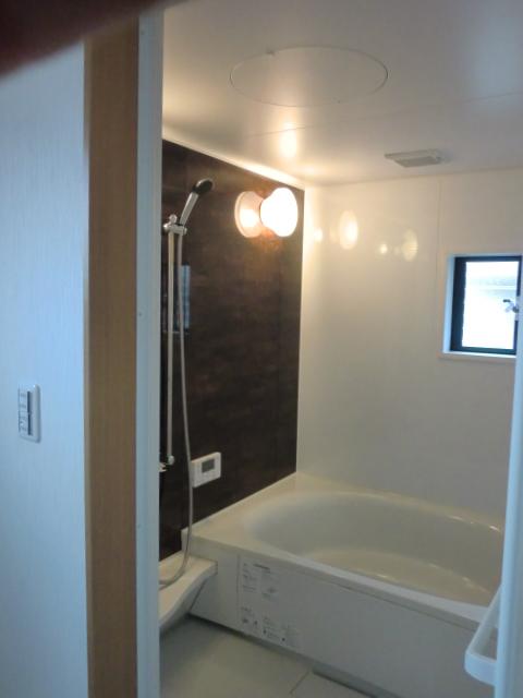 Bathroom. Spacious with 1.25 square meters size. Artificial marble wide white bathtub can also sitz bath sitting two people.