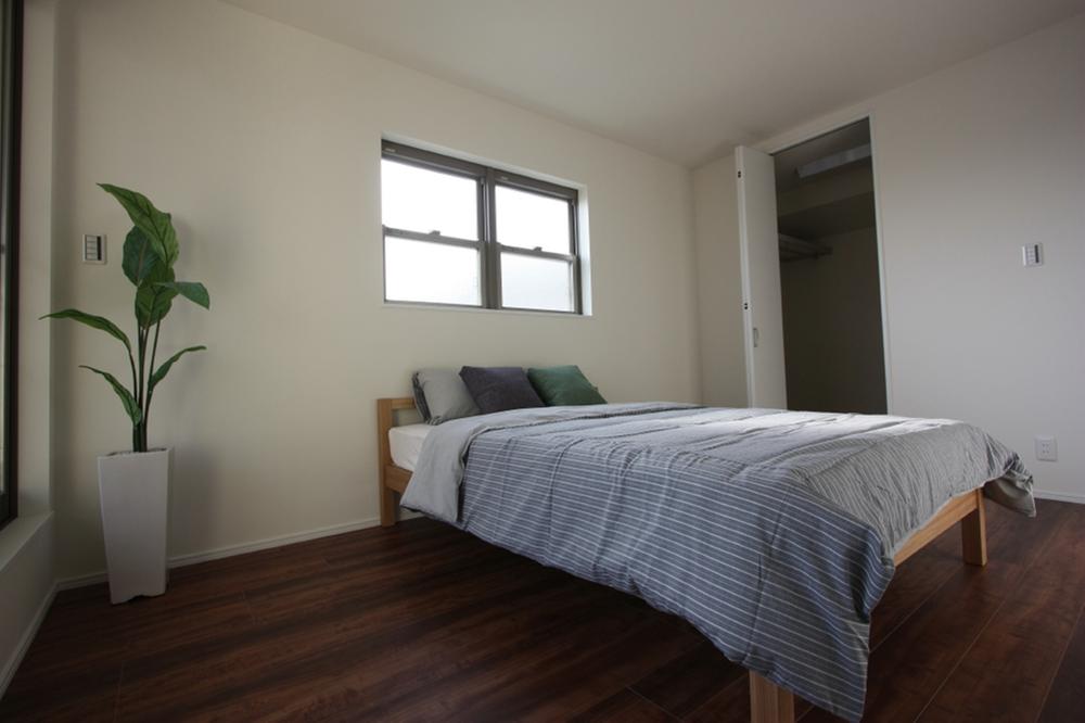 Non-living room. Walk-in closet with a bedroom