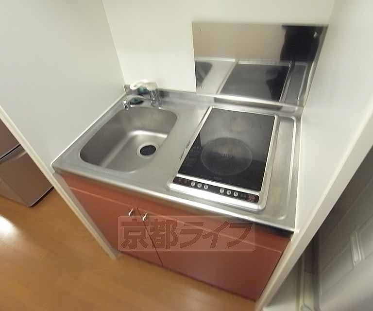 Kitchen. It is a compact kitchen.