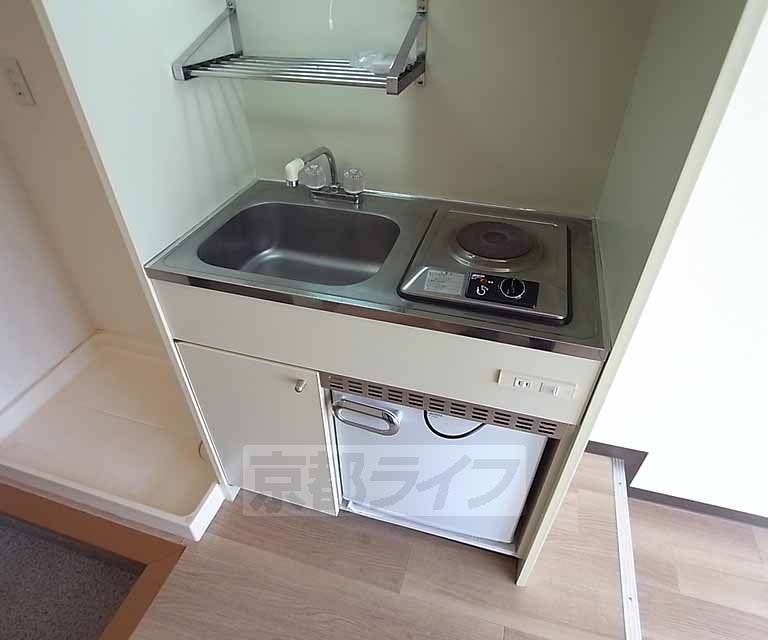 Kitchen. It is a compact kitchen.