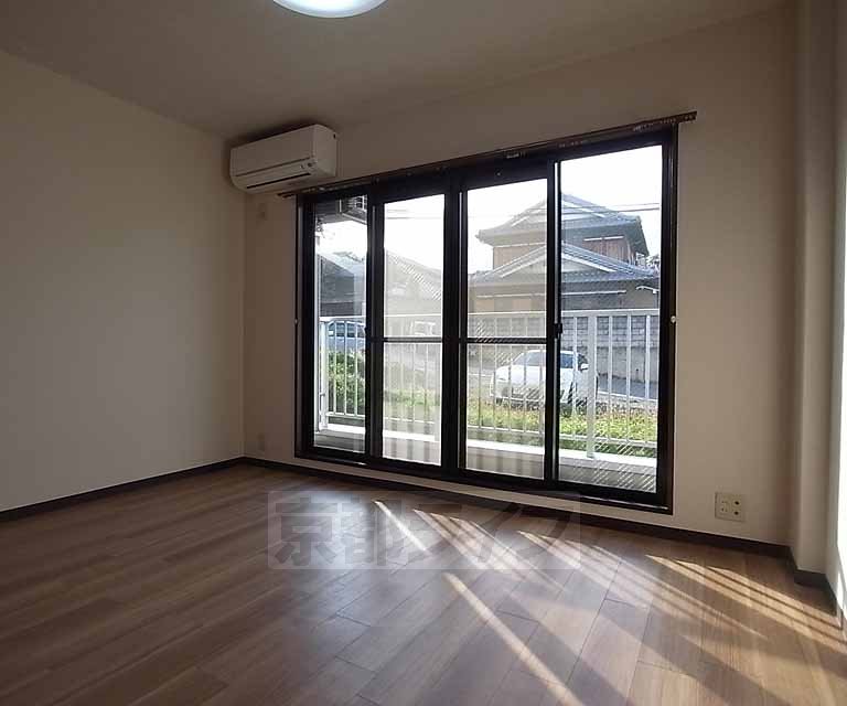 Living and room. The window is a bright big.