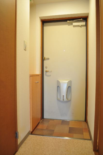 Entrance. With a shoe box