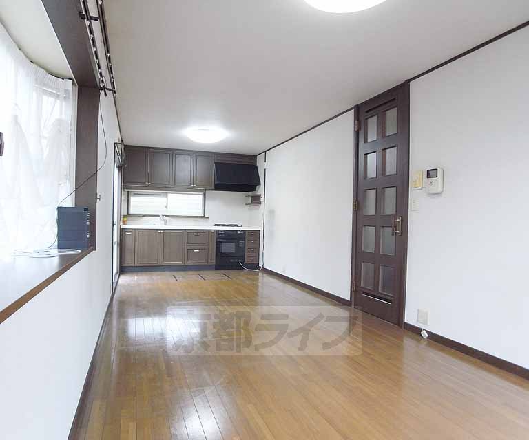 Living and room. It is cute even with bay window