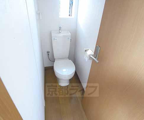 Toilet. There is a window.