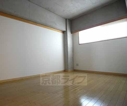 Living and room. It is bright and there is also a window.