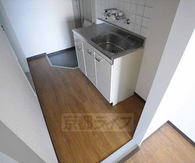 Kitchen. There is a space in the kitchen next to.