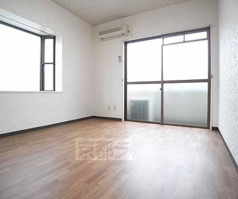 Living and room. There is a small window in the corner room