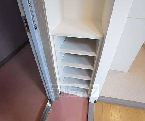 Entrance. There is also a cupboard.