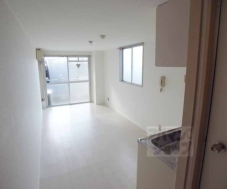 Living and room. In bright rooms with white floor!