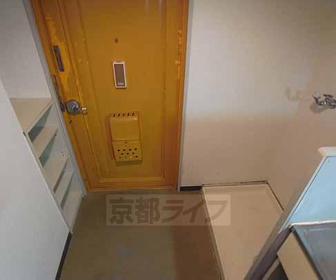 Entrance. Washing machine put in a room.