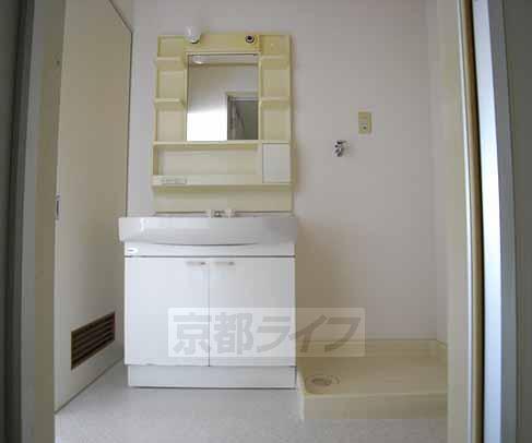 Washroom. It is a washroom with a large washbasin.