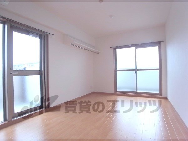 Living and room. It is a two-sided balcony in the corner room.