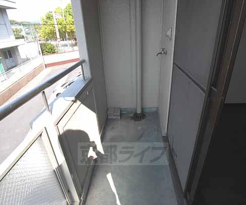 Balcony. Put the washing machine on the balcony.