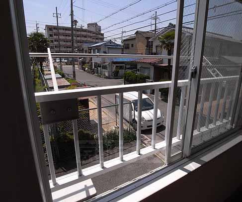 Balcony. Through washing things clothesline.