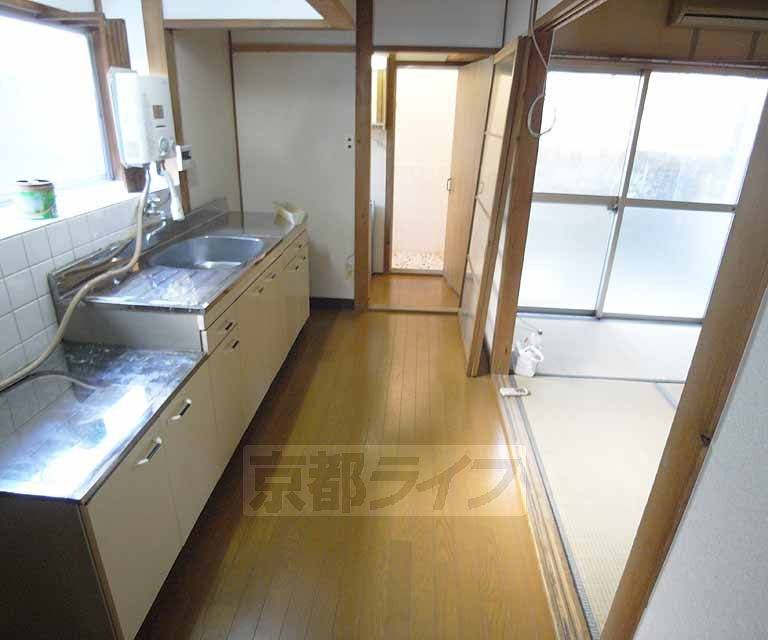 Living and room. Also spacious around the kitchen.