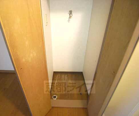 Living and room. This washing machine Storage.