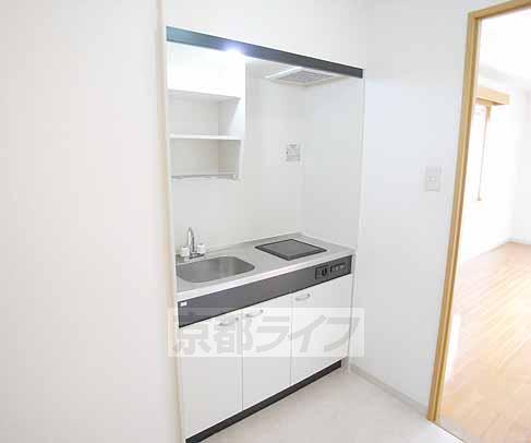 Kitchen. It is a compact kitchen.