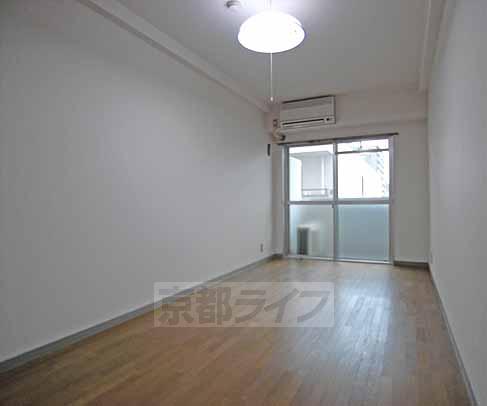 Living and room. Floor plan is rectangular.