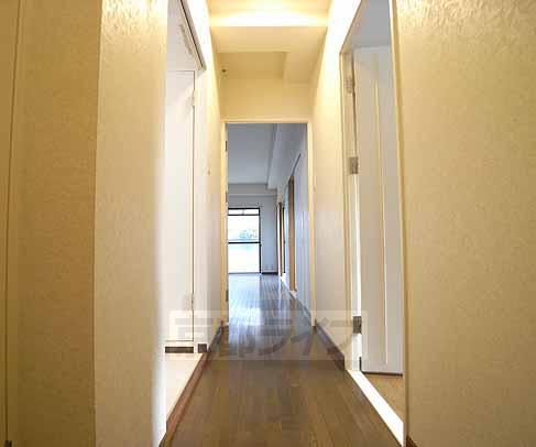 Living and room. Followed by a long corridor.