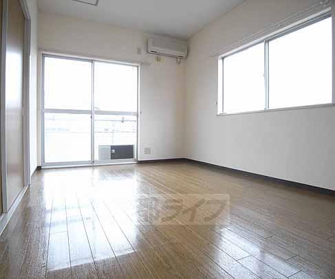 Living and room. There is between the window corner room