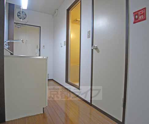 Living and room. It is also likely to put in the kitchen next to the refrigerator.