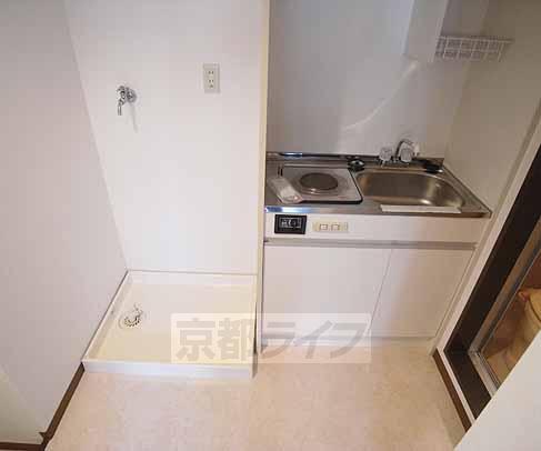 Kitchen. Next to the kitchen is the Laundry Area.