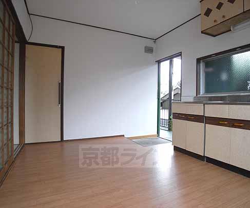 Living and room. It is a photograph of dining from the entrance.