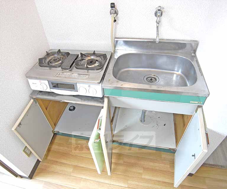 Kitchen. It contains a lot of cookware.