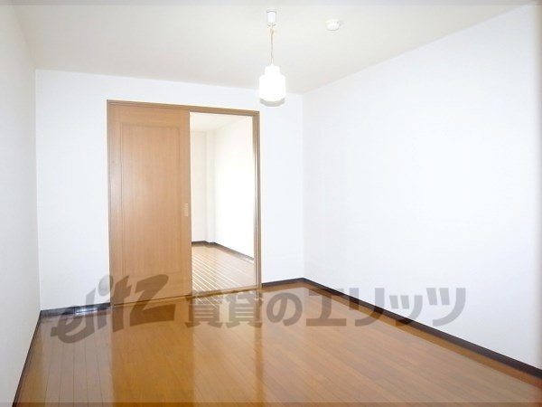 Living and room. It is the front side of the room entered from the entrance.