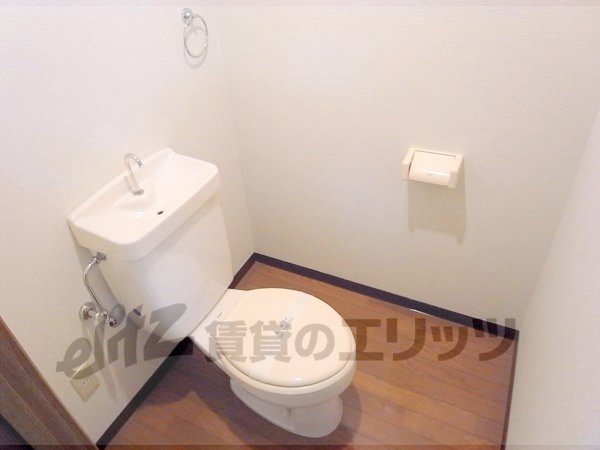 Toilet. Toilet and bath is divided.