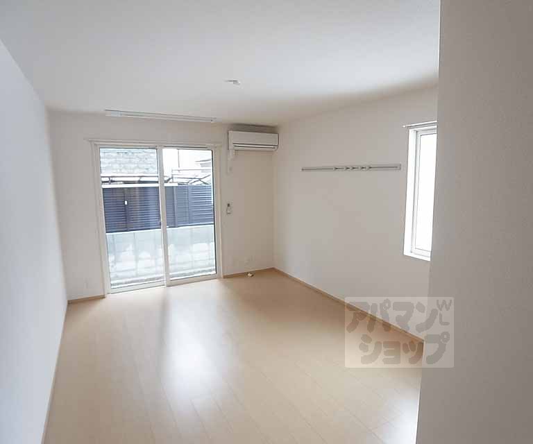 Living and room. Corner room is marked with a window on the side