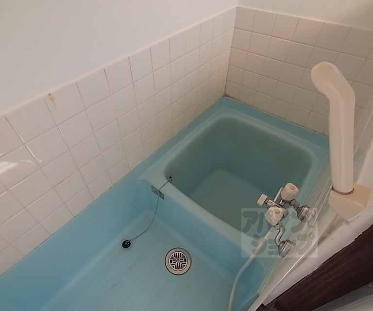 Bath. It is compact and cute bath tiled. .