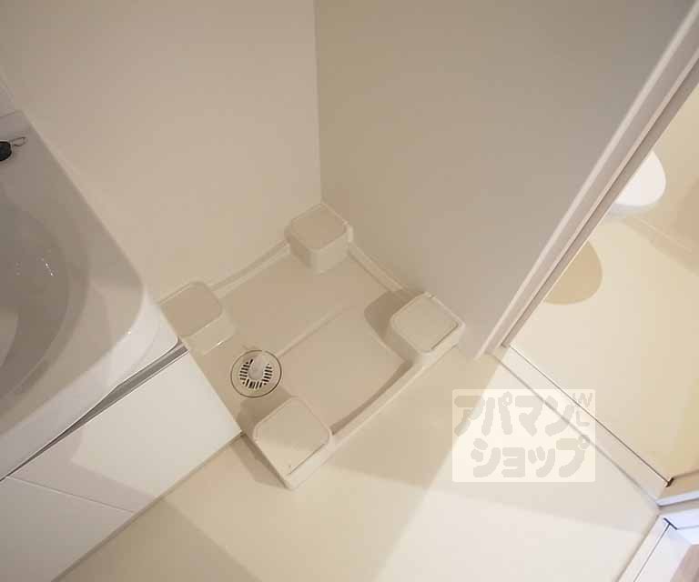 Other room space. Washing machine in the room