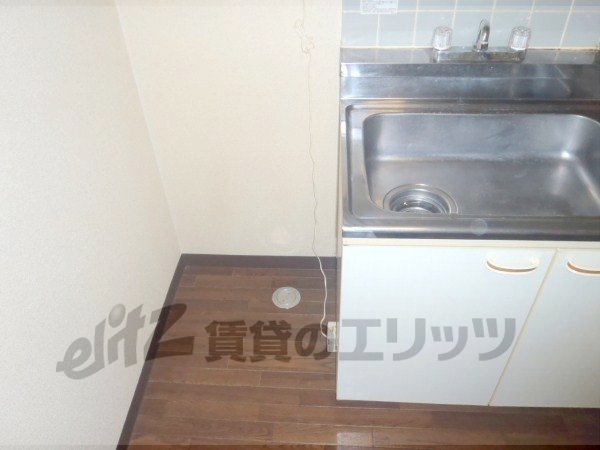 Other room space. There refrigerator space in the kitchen next to