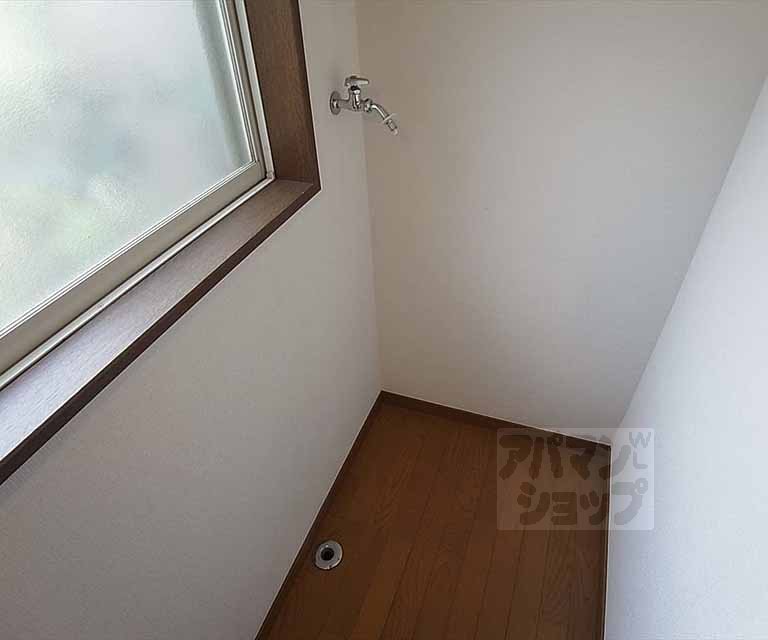 Washroom. We have set up a washing machine yard in the room.