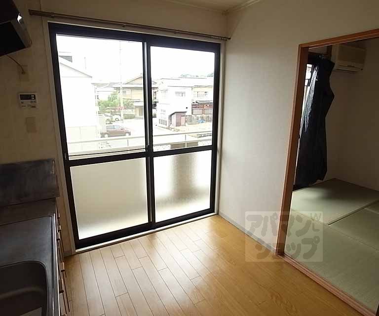 Living and room. Compact dining kitchen