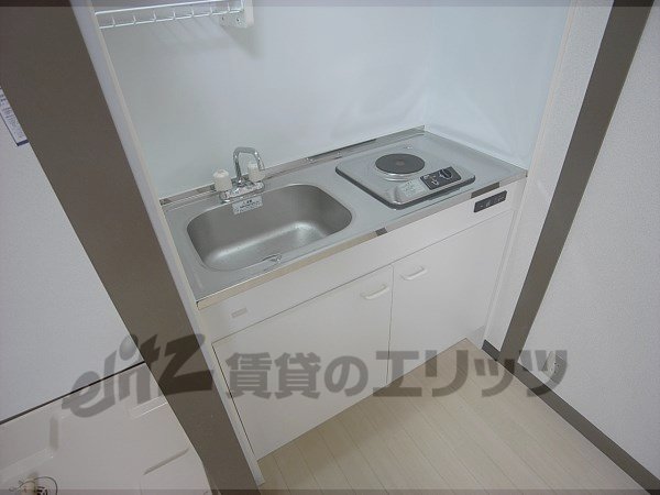 Kitchen. Bite is with a stove.